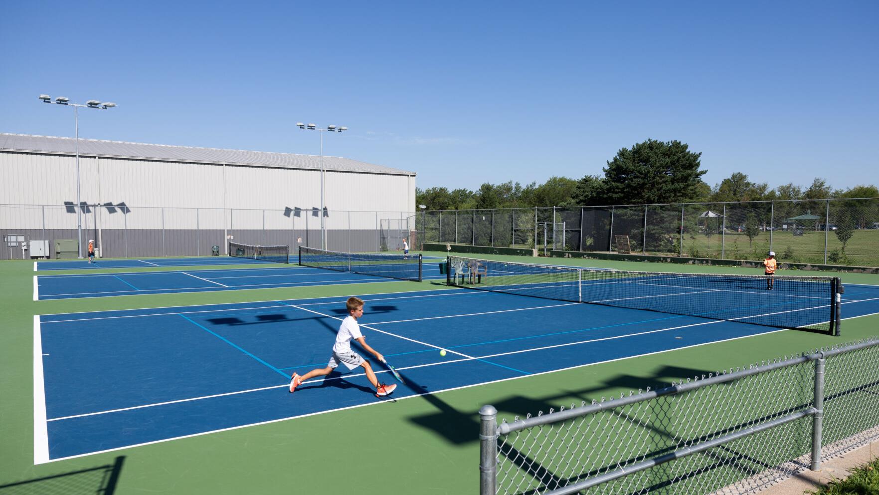 Woods Park: A long-simmering debate over green space and the need for tennis courts
